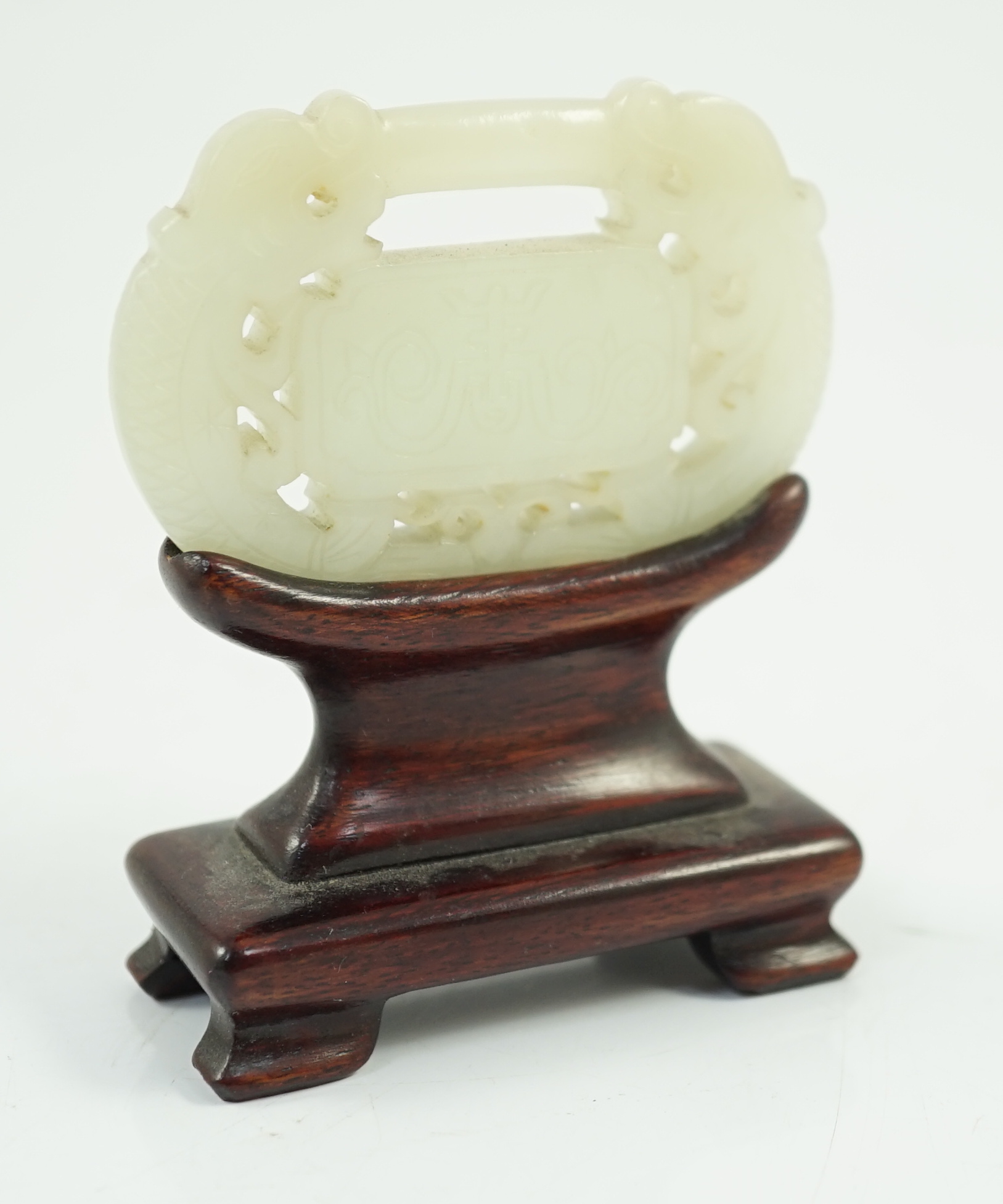 A Chinese pale celadon jade ‘lock’ pendant, 19th century